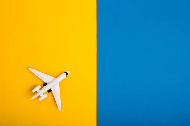 istock bright colorful background with airplan. Flat lay 1159181153