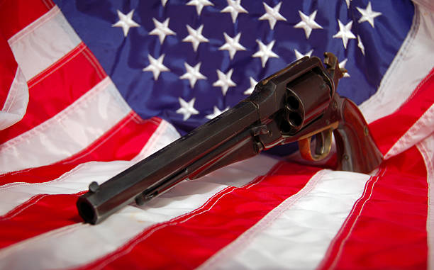 istock Right to Bear Arms- pistol on USA flag 115918169