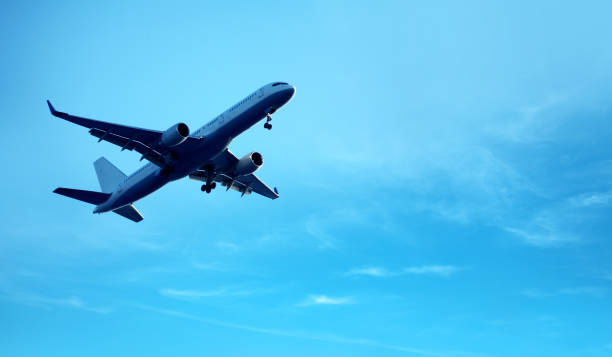 istock flying commercial passenger airplane over cloudy storm sky 1159181873