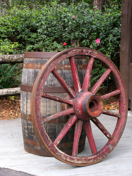 istock Vintage wooden wheel and barrel 1159183763