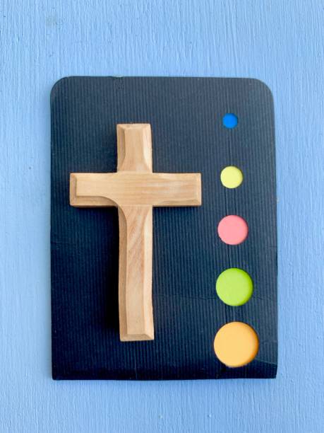 istock Wooden crucifix on blue background 1159184582