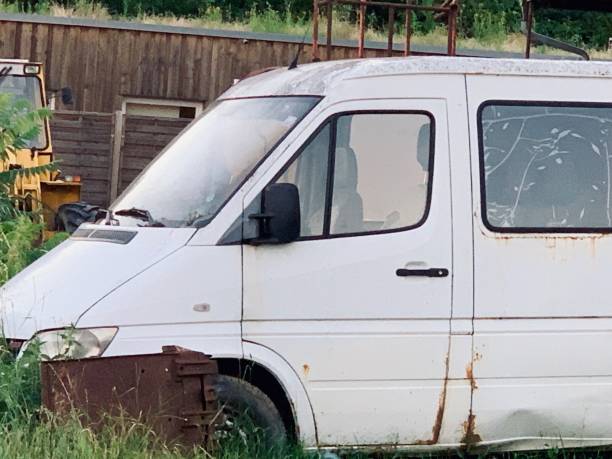 istock Abandonded old white van in the meadow 1159184746