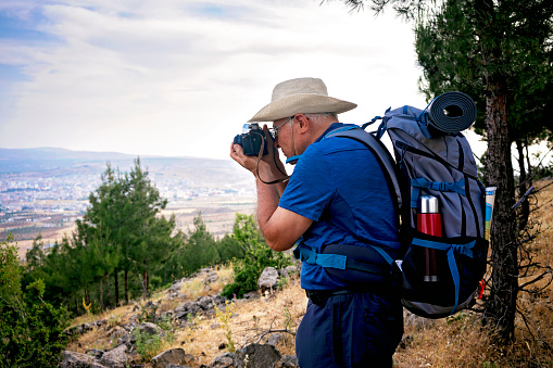 Senior Photographer at top of the mountains