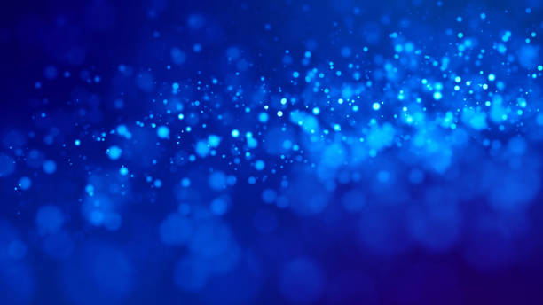 istock glow blue particles on blue background are hanging in air for bright festive presentation with depth of field and light bokeh effects. Version 1 1159187735