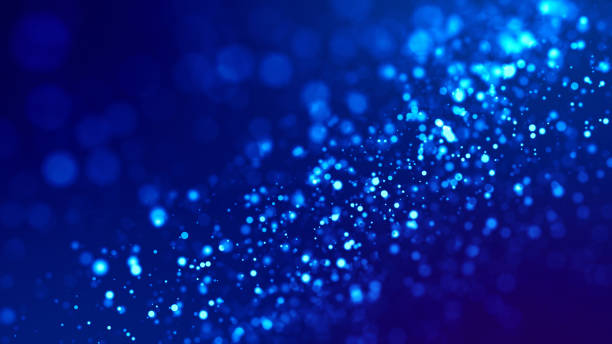 istock glow blue particles on blue background are hanging in air for bright festive presentation with depth of field and light bokeh effects. Version 3 1159187746