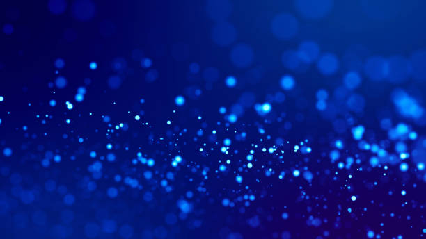 istock glow blue particles on blue background are hanging in air for bright festive presentation with depth of field and light bokeh effects. Version 4 1159187753