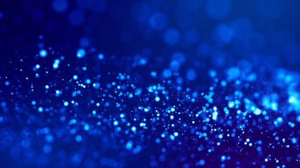 istock glow blue particles on blue background are hanging in air for bright festive presentation with depth of field and light bokeh effects. Version 5 1159187759