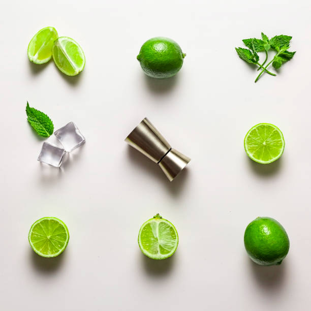 mint, lemon, mocktail, cocktail, glass, bud light, malibu, fresh, frozen, bottle, original, minty, beach, summer Mojito lime set, flat lay on white background. Ingredients, ice and jigger. Concept: Mojito Cocktail garnish stock pictures, royalty-free photos & images