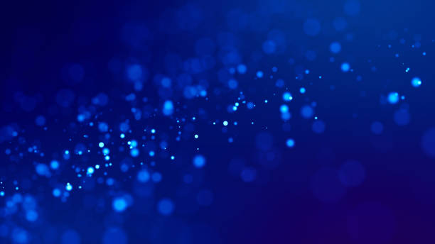 istock glow blue particles on blue background are hanging in air for bright festive presentation with depth of field and light bokeh effects. Version 15 1159187871