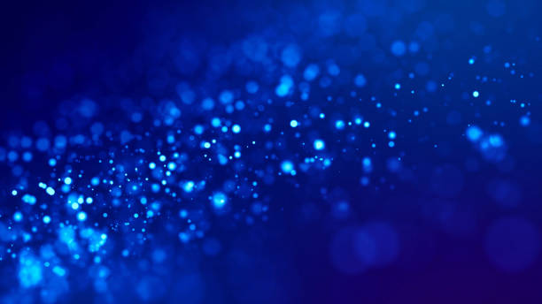 istock glow blue particles on blue background are hanging in air for bright festive presentation with depth of field and light bokeh effects. Version 16 1159187889