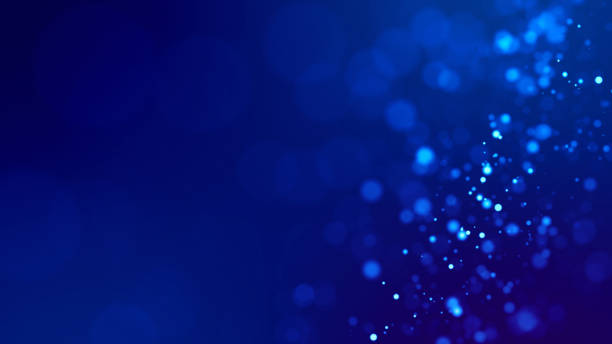 istock glow blue particles on blue background are hanging in air for bright festive presentation with depth of field and light bokeh effects. Version 20 1159187926