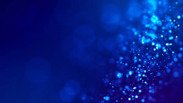 istock glow blue particles on blue background are hanging in air for bright festive presentation with depth of field and light bokeh effects. Version 21 1159187933