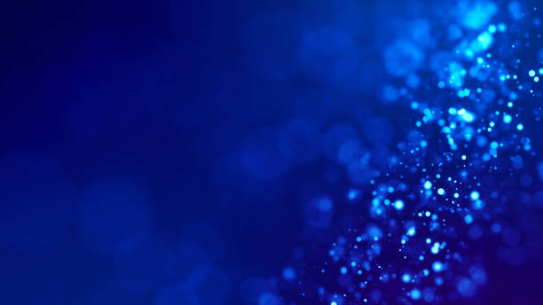 istock Microcosm. Glow blue particles on blue background are hanging in air for bright festive presentation with depth of field and light bokeh effects. Version 1 1159187947