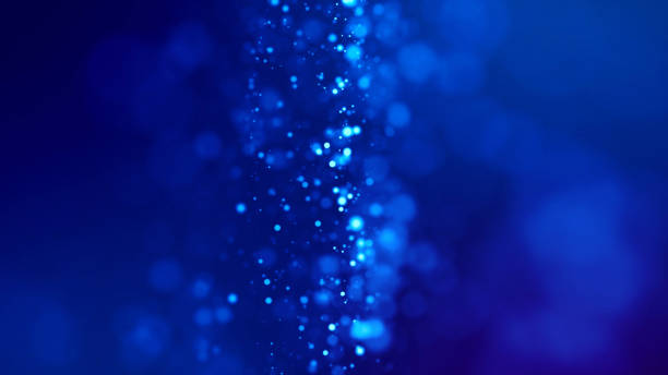 istock Microcosm. Glow blue particles on blue background are hanging in air for bright festive presentation with depth of field and light bokeh effects. Version 17 1159188642