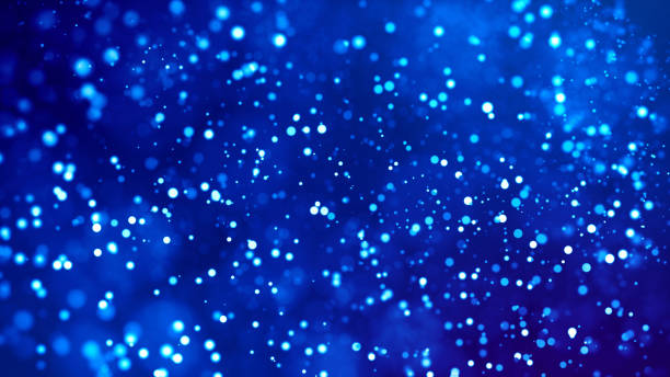 istock Microcosm. Glow blue particles on blue background are hanging in air for bright festive presentation with depth of field and light bokeh effects. Version 25 1159188724