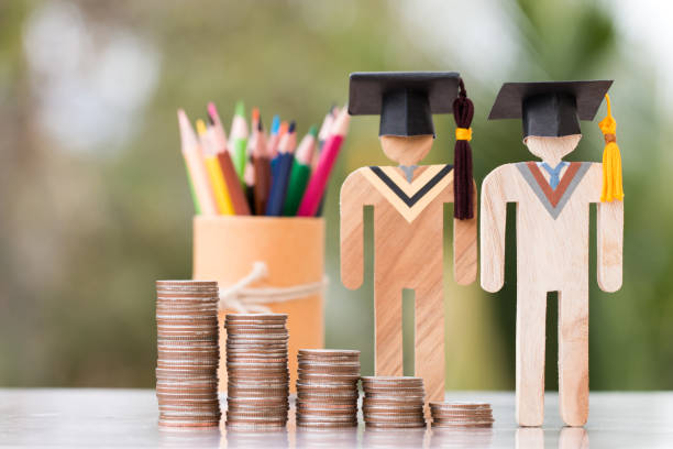 istock Concept of Budget for education learning scholaship financial fee payment, models people in university knowledge achievement for study abroad international have to money expensive for fees student 1159191645
