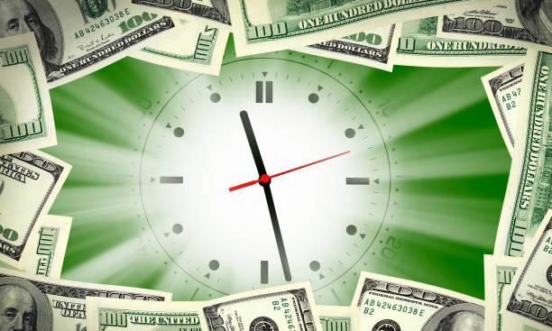 istock American dollar bills frame over shiny clock face 1159193329