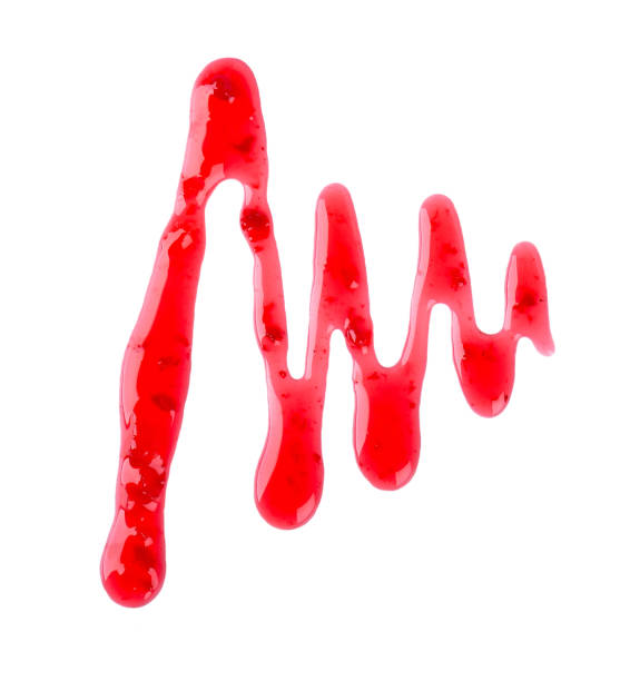 istock Cherry jam drizzle isolated on white background. Splashes of red berry jam. Top view. 1159193546