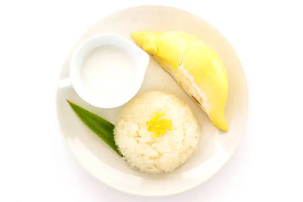 Photo of Thai sweet sticky rice with durian. Thai style tropical dessert