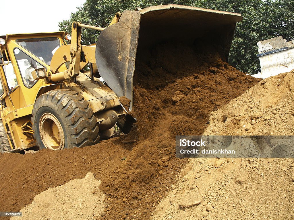 Earth mover Heavy earth-mover on work. Digging Stock Photo