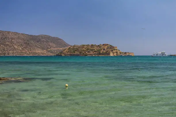 Photo of Spinalonga island in Elounda bay of Crete island in Greece