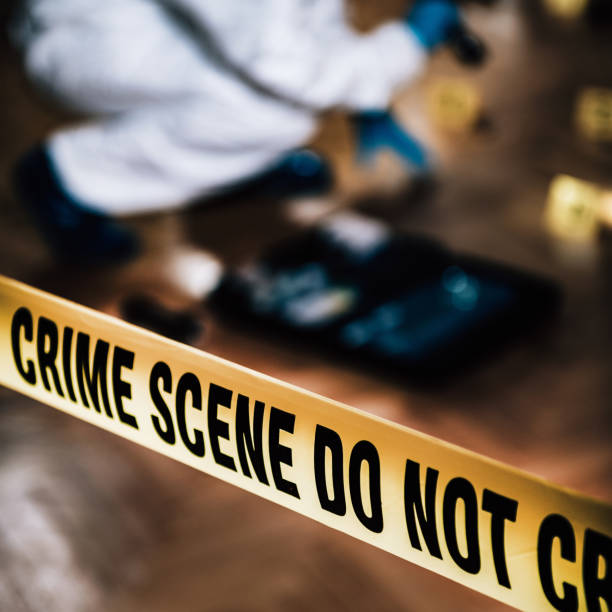 istock Forensic Science. Police Investigator Collecting Clues 1159196347