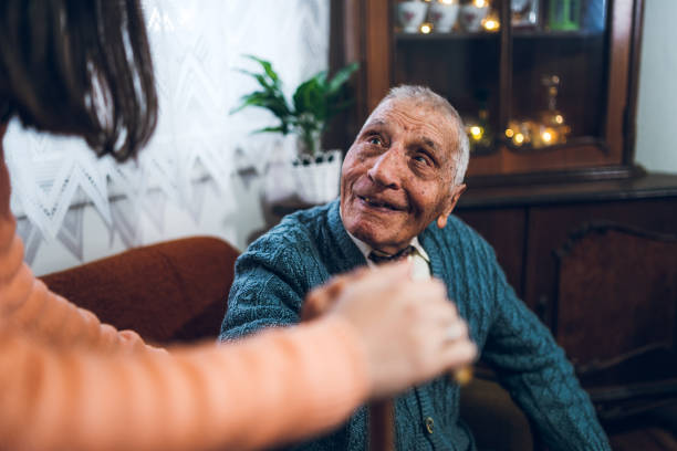 istock Granddaughter helping her grandpa 1159198770