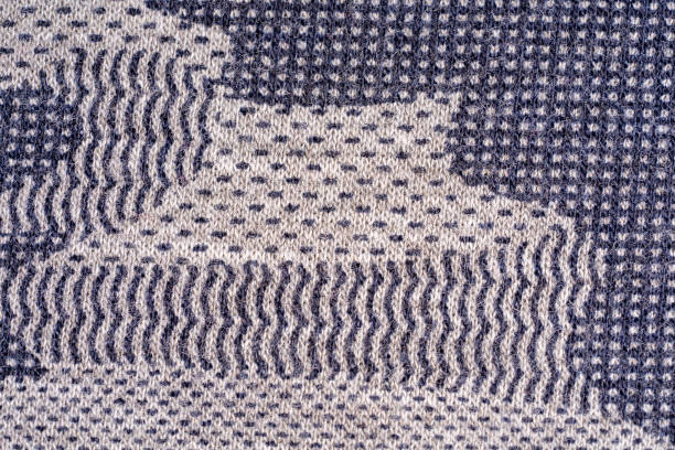 istock Khaki camouflage fabric in different shades of gray. 1159199246