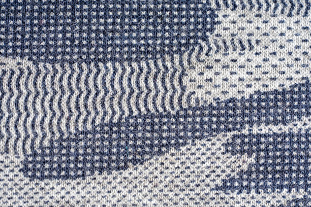 istock Khaki camouflage fabric in different shades of gray. 1159199249