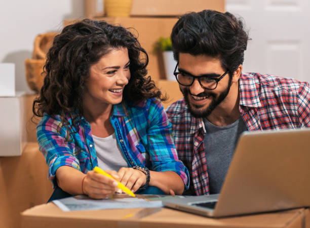 istock Happy young couple feeling excited for moving into their new home. 1159201708