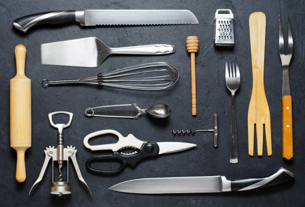 istock Wooden and metal kitchen utensils. Tools for cooking. Dark background. Flat lay 1159201802