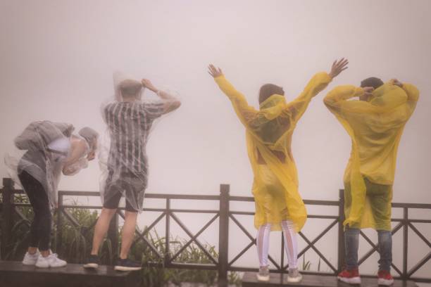 Young people hiked mountain in the rain