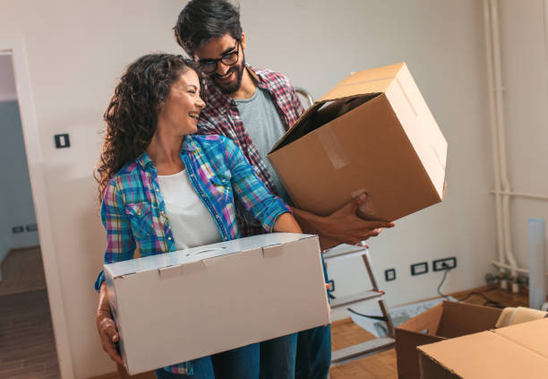 istock Happy young couple moving into their new home. 1159202899