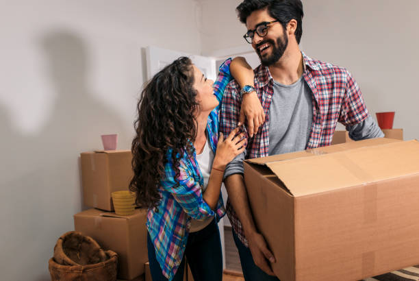 istock Happy young couple moving into their new home. 1159202921