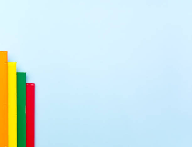 istock Bar chart made from colorful notebooks on light blue background 1159203037