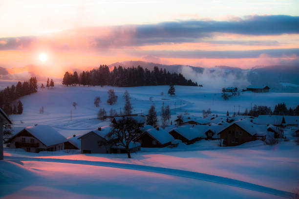 sunset in the snow covered Bregenzer Wald area of Vorarlberg, Austria with spectacular view on Mount Saentis, Switzerland