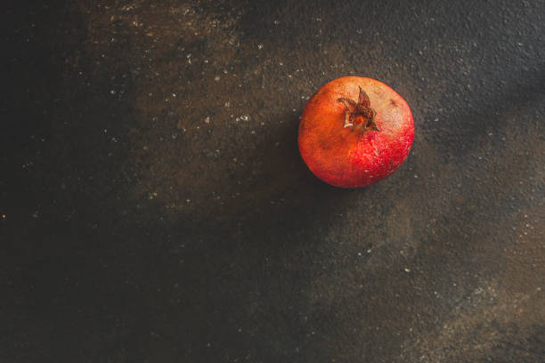 pomegranate fruit The red and green branches (vitamin dessert) have a festive atmosphere. top food background. copy space