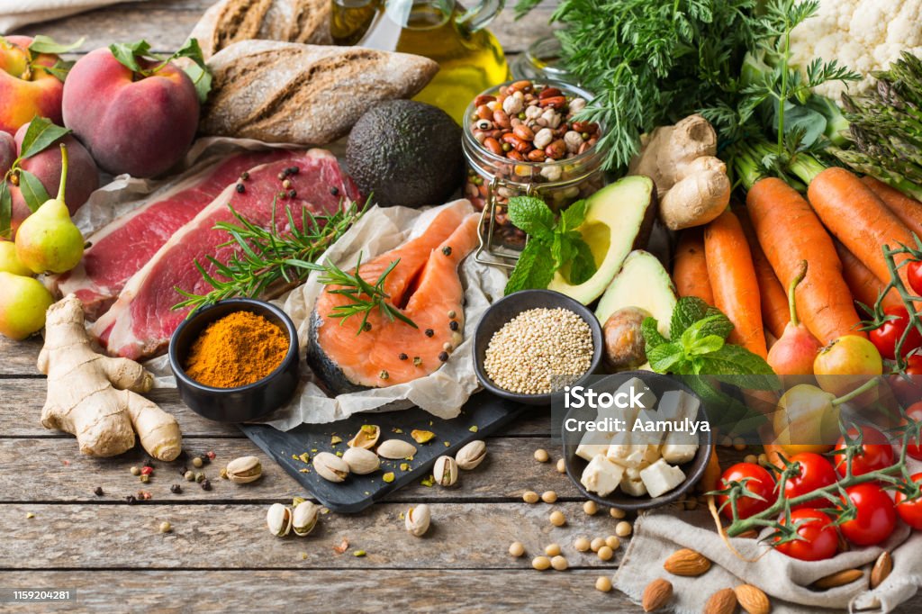 Healthy food for balanced flexitarian mediterranean diet concept Balanced nutrition concept for clean eating flexitarian mediterranean diet. Assortment of healthy food ingredients for cooking on a wooden kitchen table. Healthy Eating Stock Photo