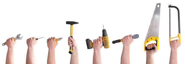 руки с различными инструментами, изолированными на белом фоне - holding screwdriver стоковые фото и изображения