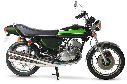 Classic 1970s Japanese motorcycle against a pure white background.