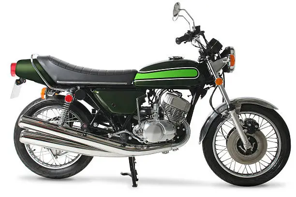 Classic 1970s Japanese motorcycle against a pure white background.