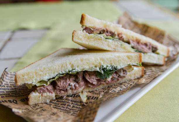 istock Beef sandwich with lettuce and parsley on a vintage newspaper_2 1159206270