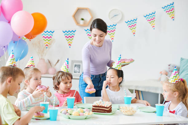 istock Giving donuts to kids 1159206645