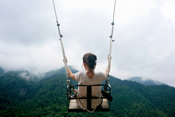 istock Female on Swing in the mountains. 1159206899