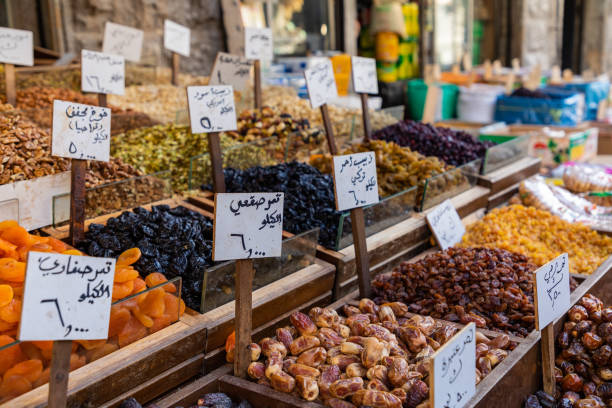 Spices, nuts and sweets shop on the market in Amman downtown, Jordan. Choice of Arabic spices on the Middle East bazaar, Jordan stock photo
