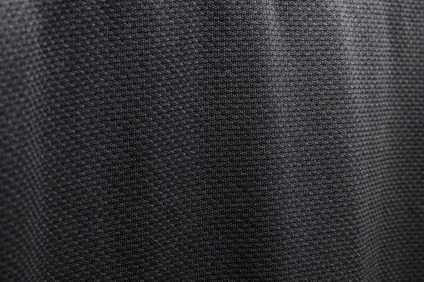 istock Close-up polyester fabric texture of black athletic shirt 1159211009
