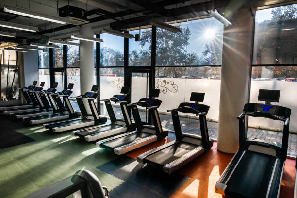 istock Large group of treadmills in a gym. 1159212970