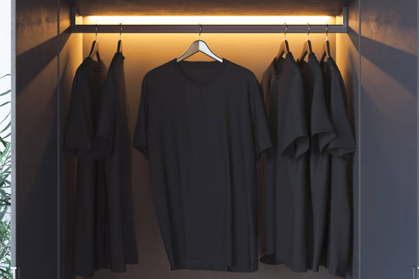 istock Black blank t-shirt with copy space in modern cupboard. 3d rendering. 1159216710