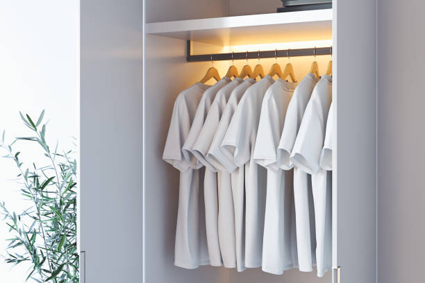 istock White blank t-shirt with copy space in modern cupboard. 3d rendering. 1159216739