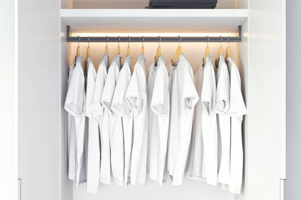 istock White blank t-shirt with copy space in modern cupboard. 3d rendering. 1159216747